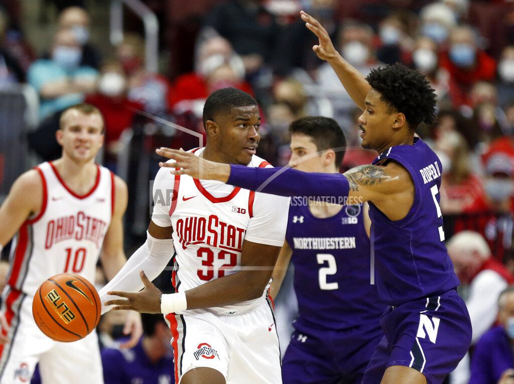 Paul Vernon Ohio State forward E.J. Liddell (3) works against Northwestern guard Julian Roper, right, during the first half of an NCAA college basketball game in Columbus, Ohio, Sunday, Jan. 9, 2022. (AP Photo/Paul Vernon)