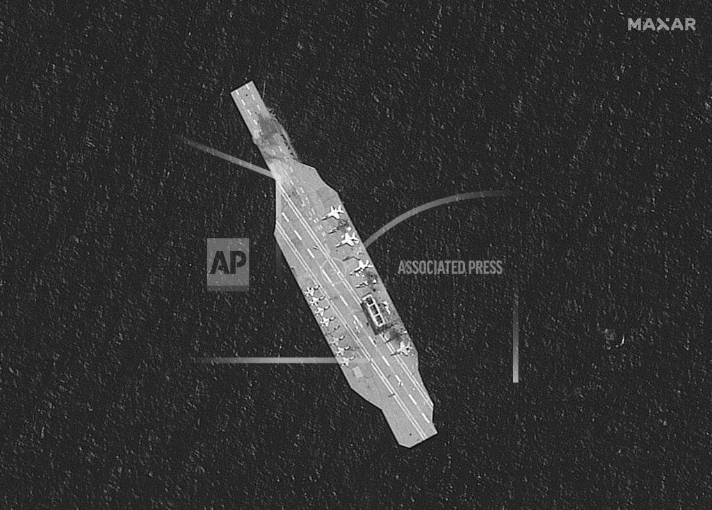 Uncredited In this Tuesday, July 28, 2020, satellite photo provided by Maxar Technologies, a mockup aircraft carrier built by Iran is seen damaged in the Strait of Hormuz amid a live-fire drill conducted by Iran's Revolutionary Guard. The Guard fired a missile from a helicopter targeting a replica aircraft carrier in the strategic Strait of Hormuz, state television reported on Tuesday, an exercise aimed at threatening the U.S. amid tensions between Tehran and Washington. (Maxar Technologies via AP)