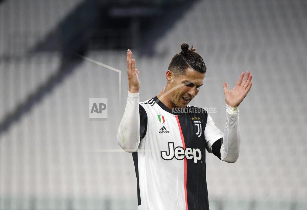 Luca Bruno Juventus' Cristiano Ronaldo reacts during an Italian Cup second leg soccer match between Juventus and AC Milan at the Allianz stadium, in Turin, Italy, Friday, June 12, 2020. The match was being played without spectators because of the coronavirus lockdown. (AP Photo/Luca Bruno)