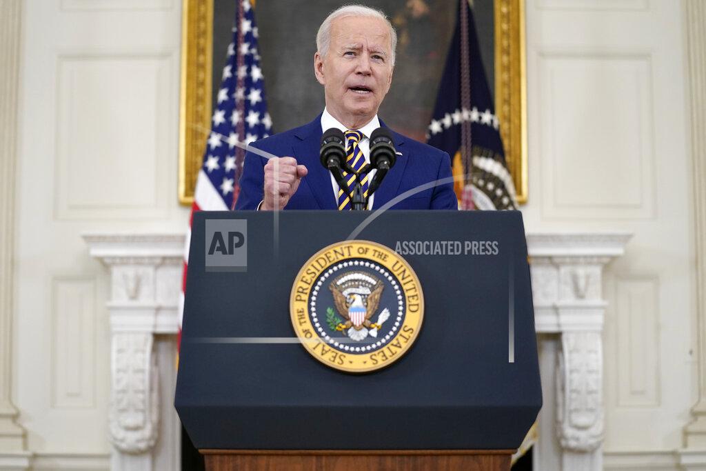 Evan Vucci President Joe Biden speaks about reaching 300 million COVID-19 vaccination shots, in the State Dining Room of the White House, Friday, June 18, 2021, in Washington. (AP Photo/Evan Vucci)