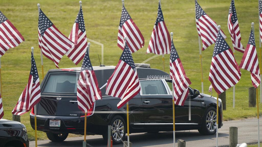 Tony Dejak The hearse carrying Navy Corpsman Maxton Soviak leaves Edison High School stadium after his funeral, Monday, Sept. 13, 2021, in Milan, Ohio. Soviak was one of 13 U.S. troops killed in a suicide bombing at Afghanistan's Kabul airport on Aug. 26. (AP Photo/Tony Dejak)