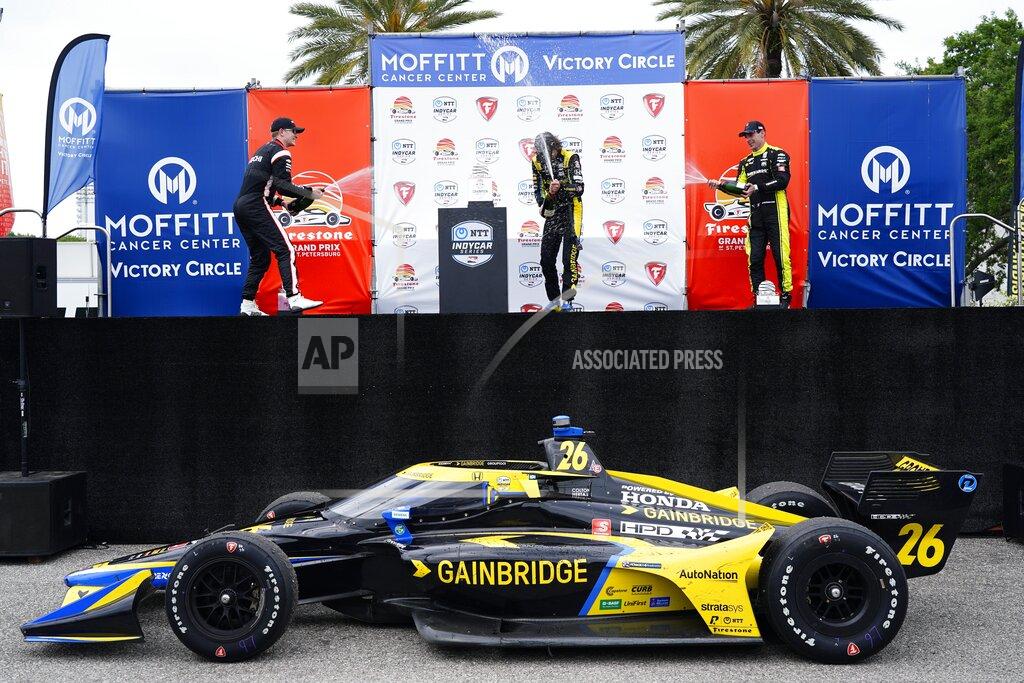 Luis Santana Second place Team Penske driver Josef Newgarden, left, first place Andretti Autosport driver Colton Herta, middle, and third place Team Penske driver Simon Pagenaud celebrate after completing the Grand Prix of St. Petersburg, Sunday, April 25, 2021 in St. Petersburg, Fla. (Luis Santana/Tampa Bay Times via AP)