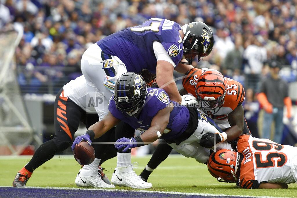 Gail Burton Baltimore Ravens running back Mark Ingram (21) dives in for a touchdown on a run as Cincinnati Bengals linebacker LaRoy Reynolds (55) and outside linebacker Nick Vigil (59) try to stop him during the first half of a NFL football game Sunday, Oct. 13, 2019, in Baltimore. (AP Photo/Gail Burton)