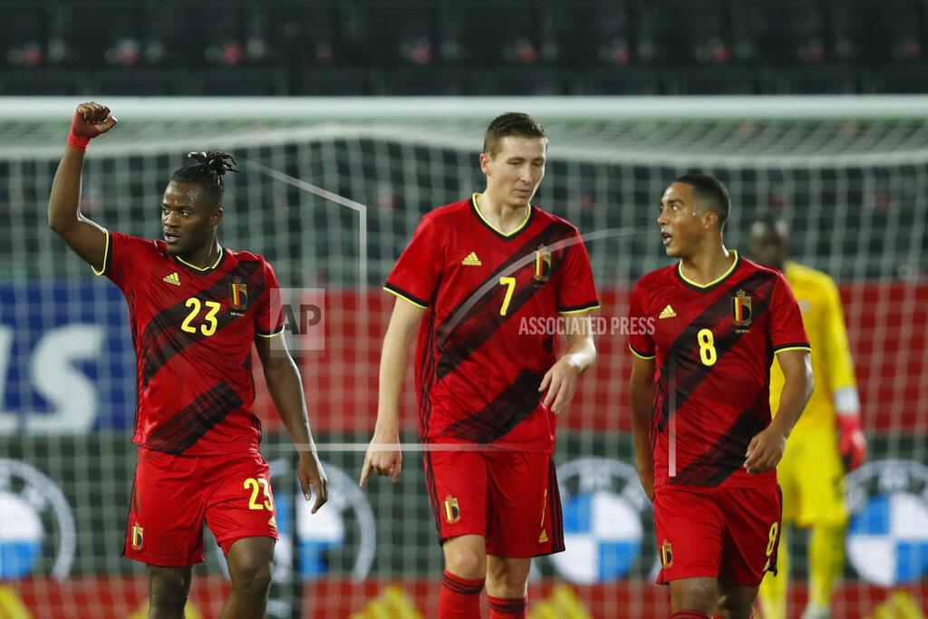 Francisco Seco Belgium's Michy Batshuayi, left, jubilates after scoring his sides second goal during an international friendly soccer match between Belgium and Switzerland at the King Power stadium in Leuven, Belgium, Wednesday, Nov. 11, 2020. (AP Photo/Francisco Seco)