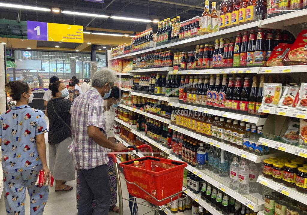 Uncredited People buy food and other grocery items at a supermarket Tuesday, Sept. 7, 2021, in Yangon, Myanmar. The main underground group coordinating resistance to Myanmar's military government called for a nationwide uprising on Tuesday, wherein they also advised people to heed their personal safety and not travel unnecessarily, as well as to stock up on food and medicine, guidance it has offered on at least one past occasion when it warned of trouble ahead. (AP Photo)