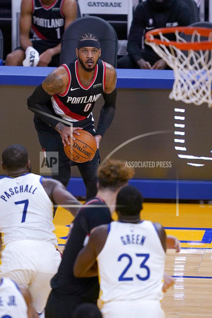Tony Avelar Portland Trail Blazers forward Carmelo Anthony (00) looks to shoot a 3-pointer against the Golden State Warriors during the first half of an NBA basketball game in San Francisco, Friday, Jan. 1, 2021. (AP Photo/Tony Avelar)