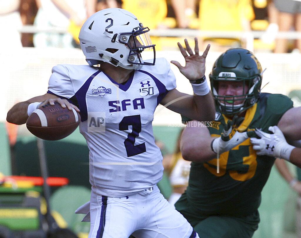Jerry Larson Stephen F. Austin Trae Self (2) passes against Baylor in the first half of an NCAA college football game Saturday, Aug. 31, 2019, in Waco, Texas. (Jerry Larson/Waco Tribune-Herald via AP)