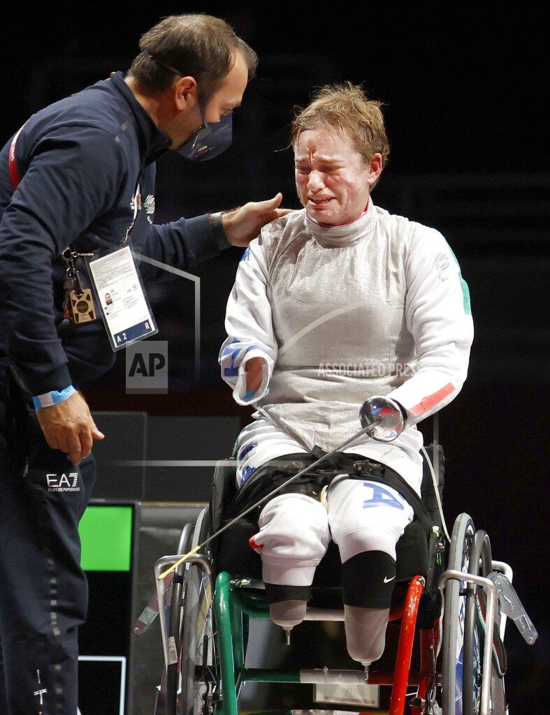Uncredited Italy's Beatrice Maria Vio celebrates after winning over China's Zhou Jingjing during their the wheelchair fencing women's foil Individual category B gold medal match in Chiba, near Tokyo, at the Tokyo 2020 Paralympic Games, Saturday, Aug. 28, 2021, in Tokyo, Japan. (Kyodo News via AP)