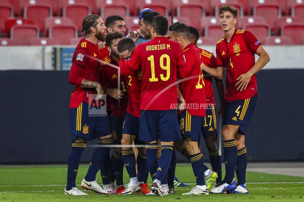 Matthias Schrader Spain players celebrate after scoring during the UEFA Nations League soccer match against Germany at the Mercedes-Benz Arena stadium in Stuttgart, Germany, Thursday, Sept. 3, 2020. (AP Photo/Matthias Schrader)