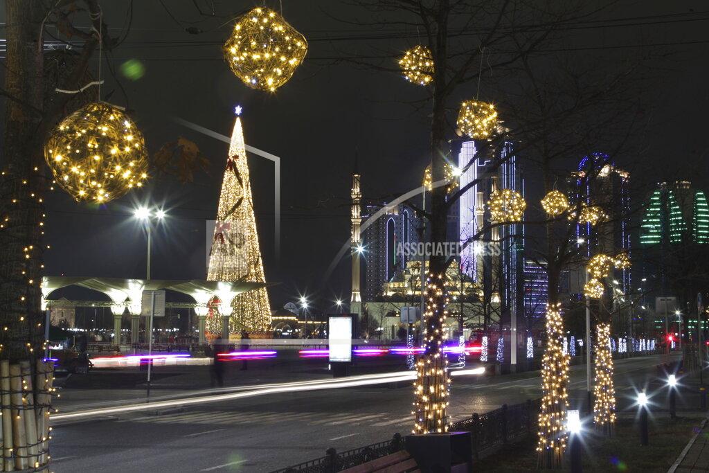 Musa Sadulayev A square decorated for New Year celebrations is seen nearly deserted and without the Holiday Market due to the virus-related restrictions prior to New Year's celebrations in Grozny, Russia, Thursday, Dec. 31, 2020. (AP Photo/Musa Sadulayev)