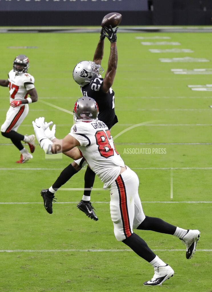 Isaac Brekken Las Vegas Raiders cornerback Trayvon Mullen (27) tips a pass intended for Tampa Bay Buccaneers tight end Rob Gronkowski (87) during the second half of an NFL football game, Sunday, Oct. 25, 2020, in Las Vegas. (AP Photo/Isaac Brekken)