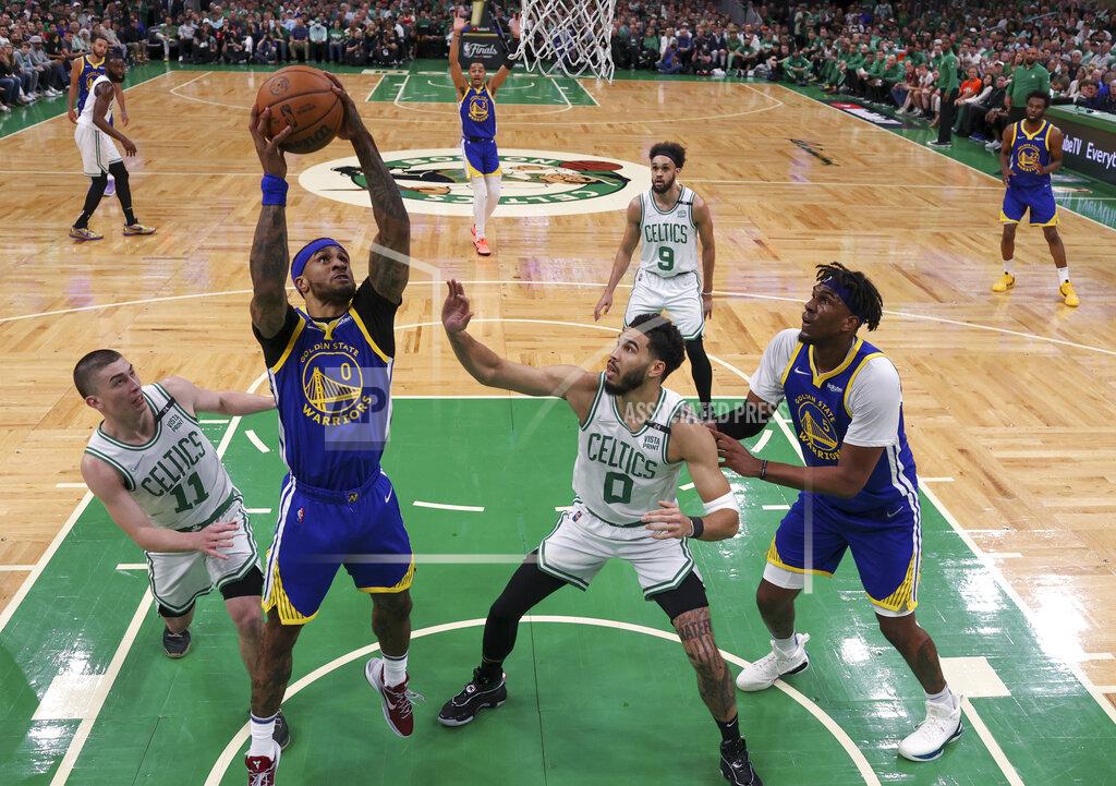 Elsa Golden State Warriors guard Gary Payton II (0) puts up a shot against the Boston Celtics during the first quarter of Game 6 of basketball's NBA Finals, Thursday, June 16, 2022, in Boston. (Elsa/Pool Photo via AP)