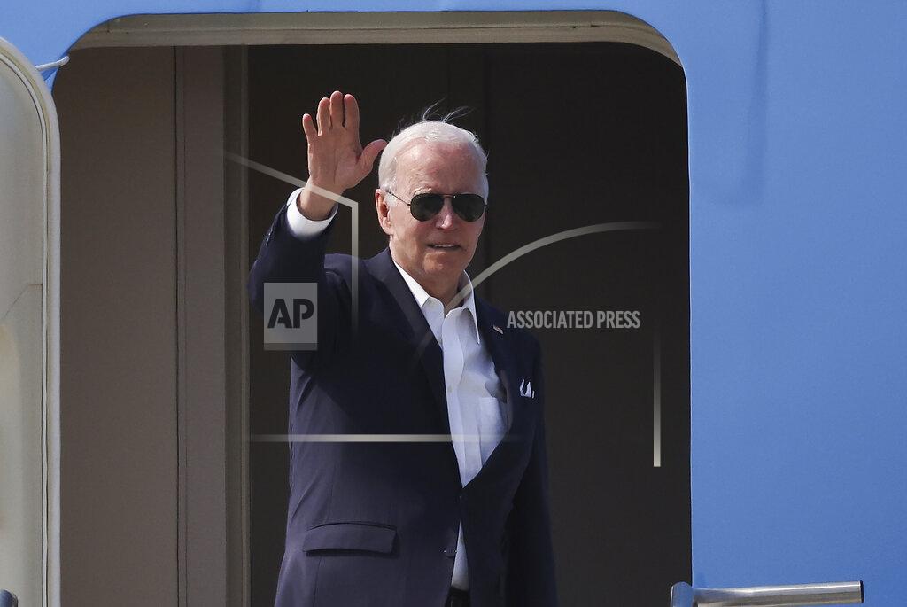 Kim Hong-Ji U.S. President Joe Biden gestures as he departs for Japan at Osan Air Base in Pyeongtaek, South Korea, Sunday, May 22, 2022. (Kim Hong-Ji/Pool Photo via AP)