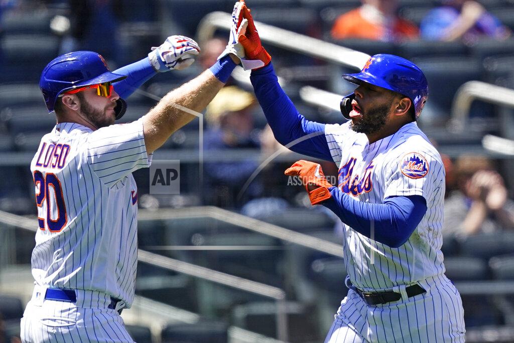 Kathy Willens New York Mets' Pete Alonso (20) greets Dominic Smith (2) at the plate after the pair scored on Kevin Pillar's two-run triple during the second inning of a baseball game against the Baltimore Orioles, Wednesday, May 12, 2021, in New York. (AP Photo/Kathy Willens)