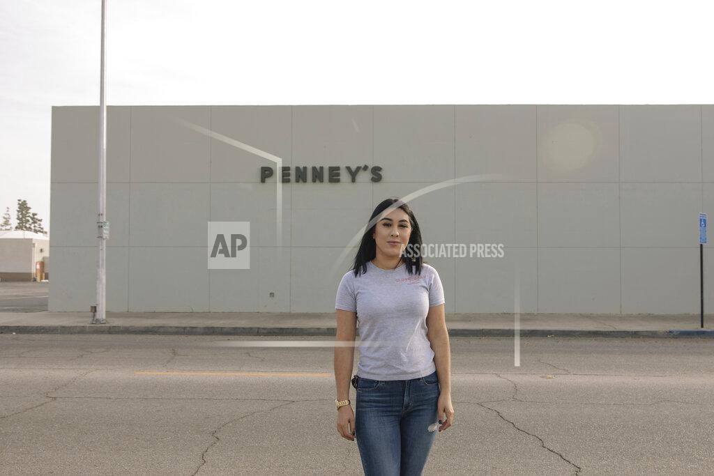 Madeline Tolle Alexandra Orozco stands for a portrait outside of the closed J.C. Penney, where she used to work, in Delano, Calif., on Sunday, Dec. 6, 2020. The 118-year-old department store chain filed for bankruptcy in May. (Madeline Tolle/The Fuller Project via AP)