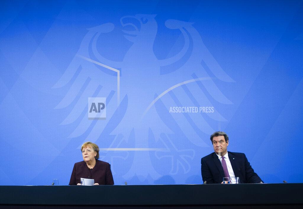 Markus Schreiber FILE - In this file photo dated Wednesday, Feb. 10, 2021, German Chancellor Angela Merkel, left, with Bavarian state governor Markus Soeder, during a news conference at the chancellery in Berlin, Germany. The 54-year-old Soeder is fighting to win enough backing across the political spectrum in hope of succeeding Angela Merkel as chancellor of Germany in Autumn 2021. (AP Photo/Markus Schreiber, FILE)