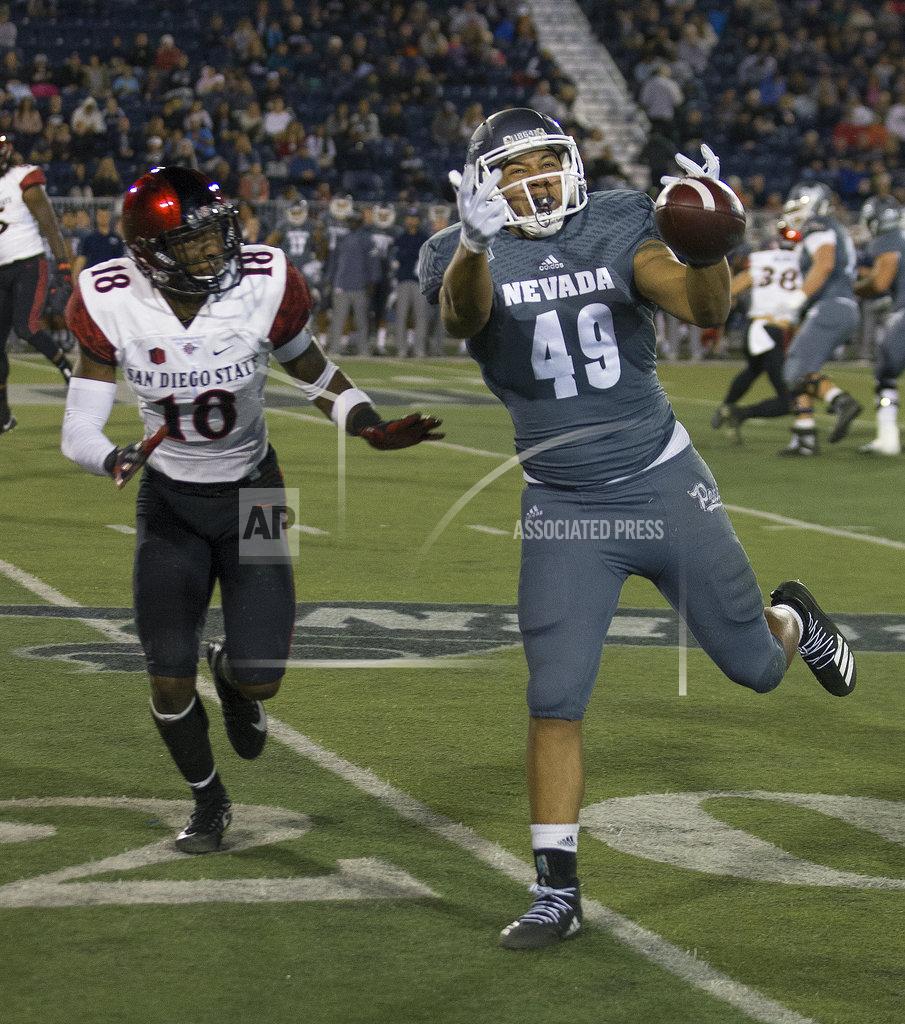 Tom R. Smedes Nevada receiver Trae Carter-Wells (49) cannot make the catch against San Diego State in the first half of an NCAA college football game in Reno, Nev., Saturday, Oct. 27, 2018. (AP Photo/Tom R. Smedes)