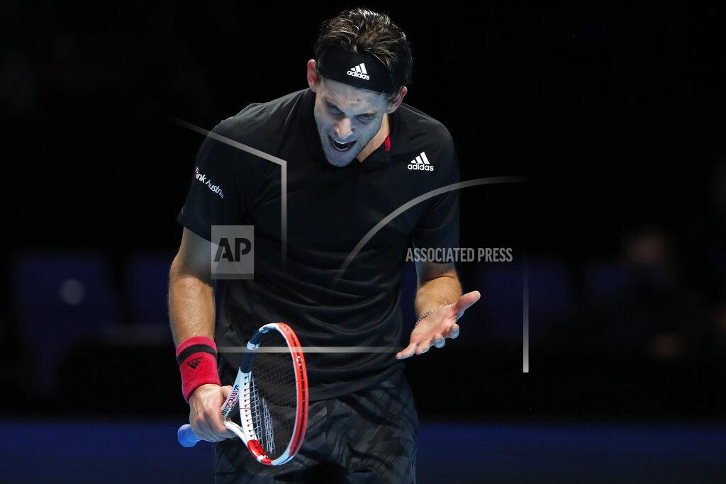 Frank Augstein Dominic Thiem of Austria reacts after losing a point against Daniil Medvedev of Russia during their singles final tennis match at the ATP World Finals tennis tournament at the O2 arena in London, Sunday, Nov. 22, 2020. (AP Photo/Frank Augstein)
