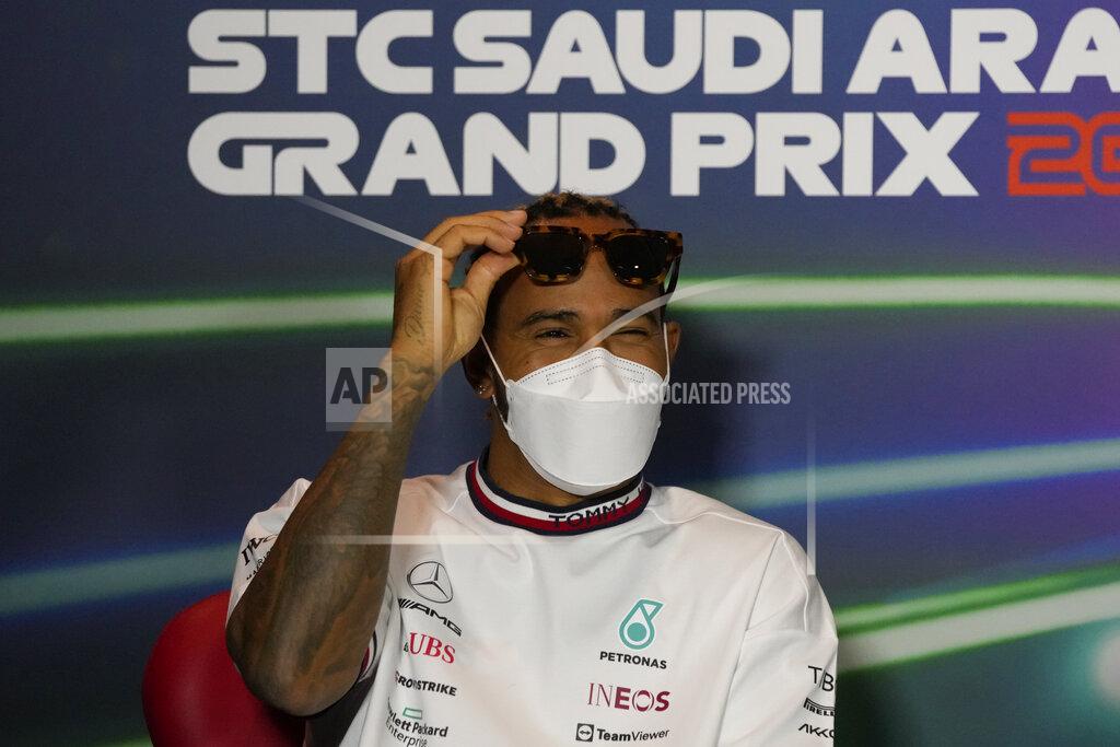 Hassan Ammar Mercedes driver Lewis Hamilton of Britain gestures during a press conference at the Jiddah corniche circuit in Jiddah, Saudi Arabia, Friday, March 25, 2022. (AP Photo/Hassan Ammar)