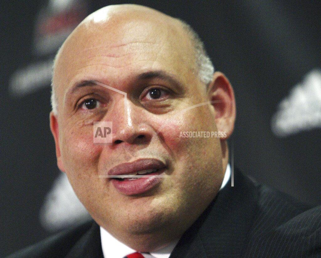 Rob Winner FILE - In this Tuesday, July 16, 2013, file photo, Sean Frazier fields questions from reporters after being introduced as the new athletic director at Northern Illinois University during a news conference, in DeKalb, Ill. In 2018, facing the possibility of cutting staff to make up a huge shortfall in state funding, Frazier added a football game at Florida State to Northern Illinois' schedule. The road trip came with a $1.6 million payout to NIU. (Rob Winner/Daily Chronicle via AP, File)