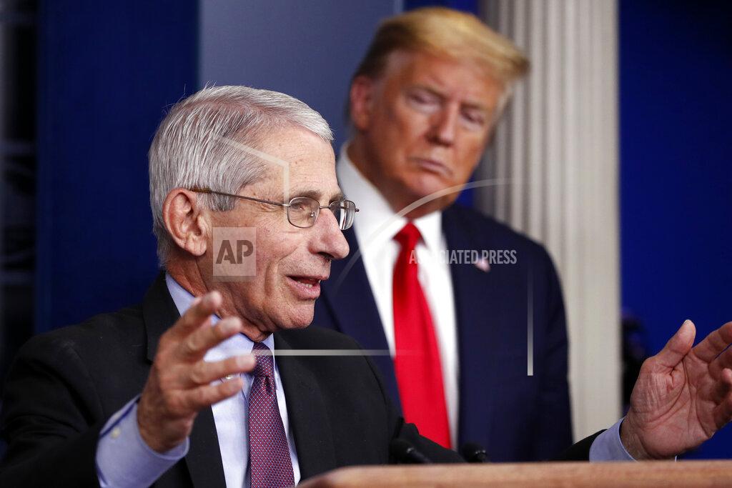 Alex Brandon FILE - In this April 22, 2020 file photo President Donald Trump watches as Dr. Anthony Fauci, director of the National Institute of Allergy and Infectious Diseases, speaks about the coronavirus in the James Brady Press Briefing Room of the White House in Washington. After weeks of near-daily plugs for the use of hydroxychloroquine to help treat COVID-19 patients, Trump and the White House abruptly stopped discussing the drug a week ago. His promotion of the drug, based on isolated reports and instinct, frequently put him at odds with medical professionals, including Fauci, the nation's top infectious disease expert, who said evidence for the efficacy of the drug for COVID-19 patients was "anecdotal." (AP Photo/Alex Brandon,File)