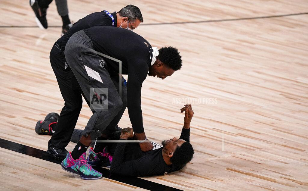 Mark J. Terrill Miami Heat's Bam Adebayo, left, and Miami Heat's Udonis Haslem, right, horseplay before the first half in Game 3 of basketball's NBA Finals, Sunday, Oct. 4, 2020, in Lake Buena Vista, Fla. (AP Photo/Mark J. Terrill)