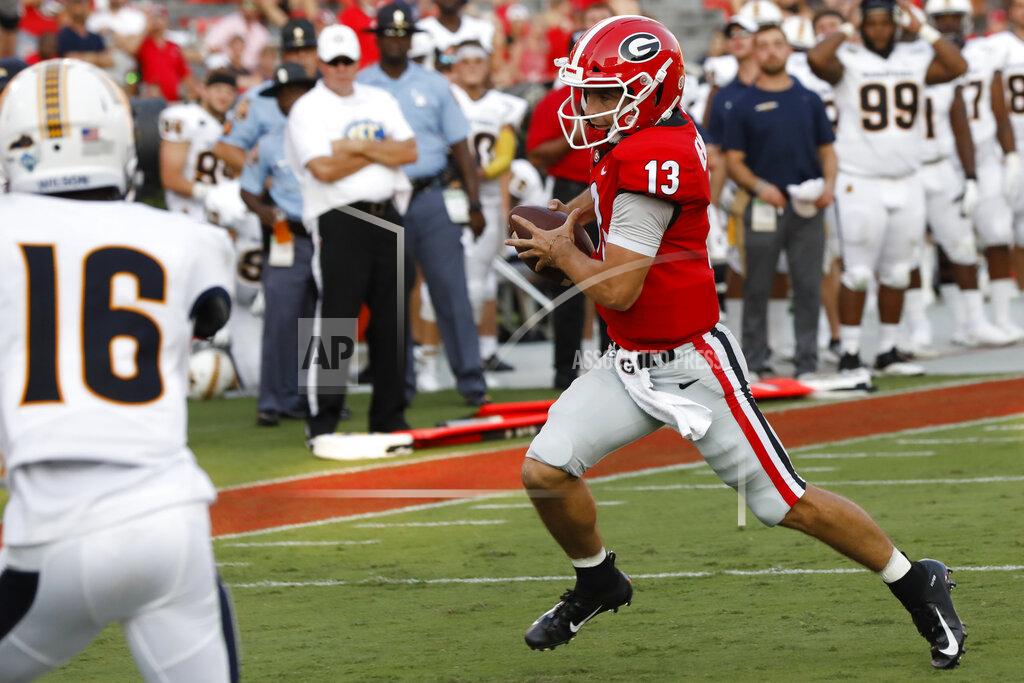 Joshua L. Jones Georgia quarterback Stetson Bennett (13) drives in for a touchdown against Murray State in the second half of an NCAA college football game Saturday, Sept. 7, 2019, in Athens, Ga. (Joshua L. Jones/Athens Banner-Herald via AP)