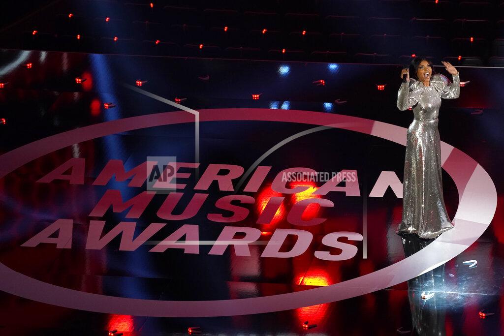 Chris Pizzello Host Taraji P. Henson is seen at the American Music Awards on Sunday, Nov. 22, 2020, at the Microsoft Theater in Los Angeles. (AP Photo/Chris Pizzello)