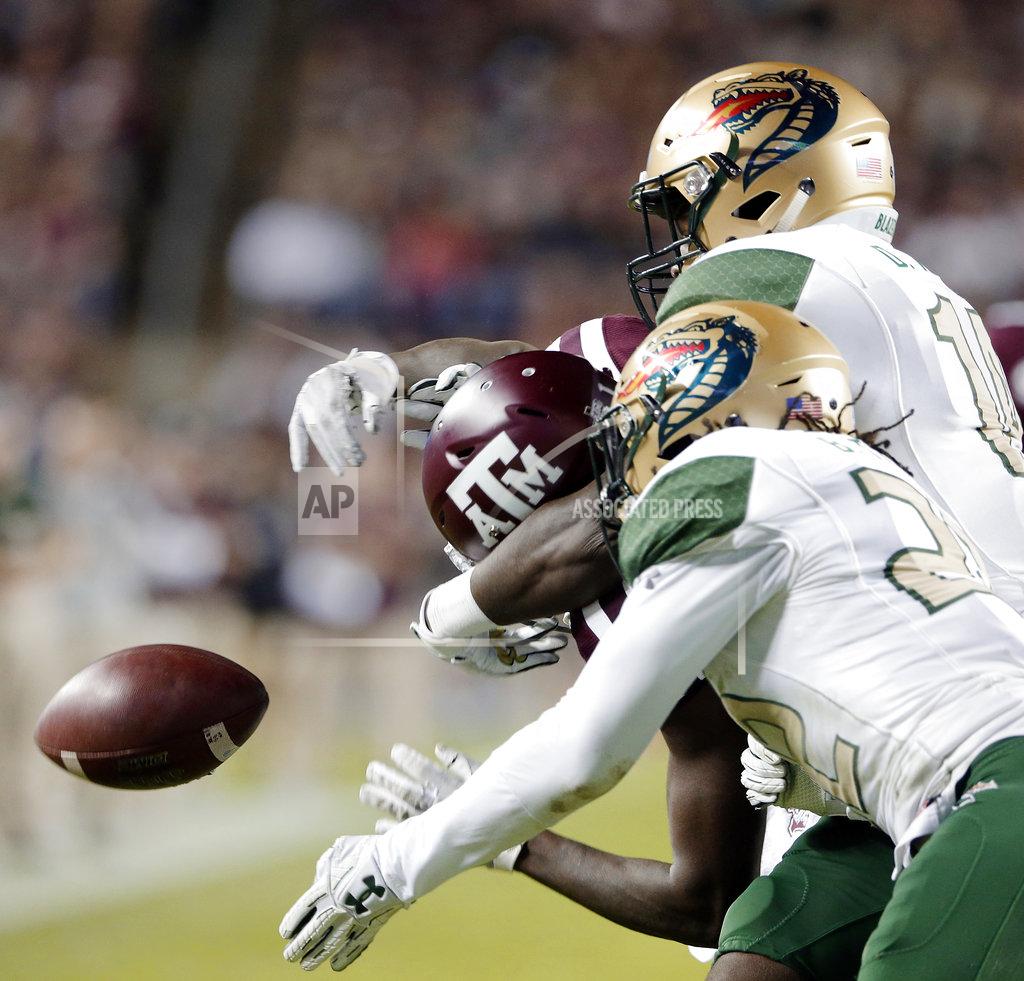 Michael Wyke Texas A&M wide receiver Quartney Davis, left, can't make the reception as UAB safety Broderick Thomas (22) and cornerback Dy'jonn Turner, right, defend during the first half of an NCAA college football game Saturday, Nov. 17, 2018, in College Station, Texas. UAB was called for interference. (AP Photo/Michael Wyke)