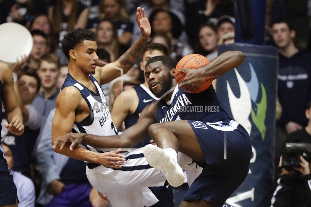 Michael Conroy Villanova forward Eric Paschall (4) and Butler forward Jordan Tucker (1) get tied up as they go for a rebound in the first half of an NCAA college basketball game in Indianapolis, Tuesday, Jan. 22, 2019. (AP Photo/Michael Conroy)