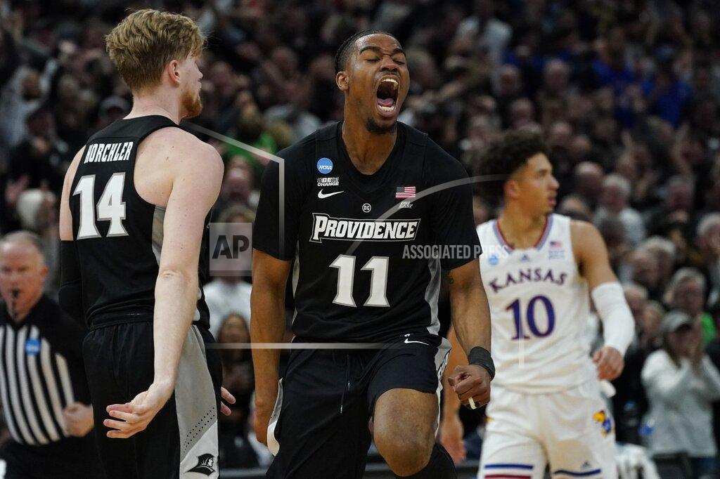 Nam Y. Huh Providence's A.J. Reeves reqacts during the second half of a college basketball game in the Sweet 16 round of the NCAA tournament against Kansas Friday, March 25, 2022, in Chicago. (AP Photo/Nam Y. Huh)