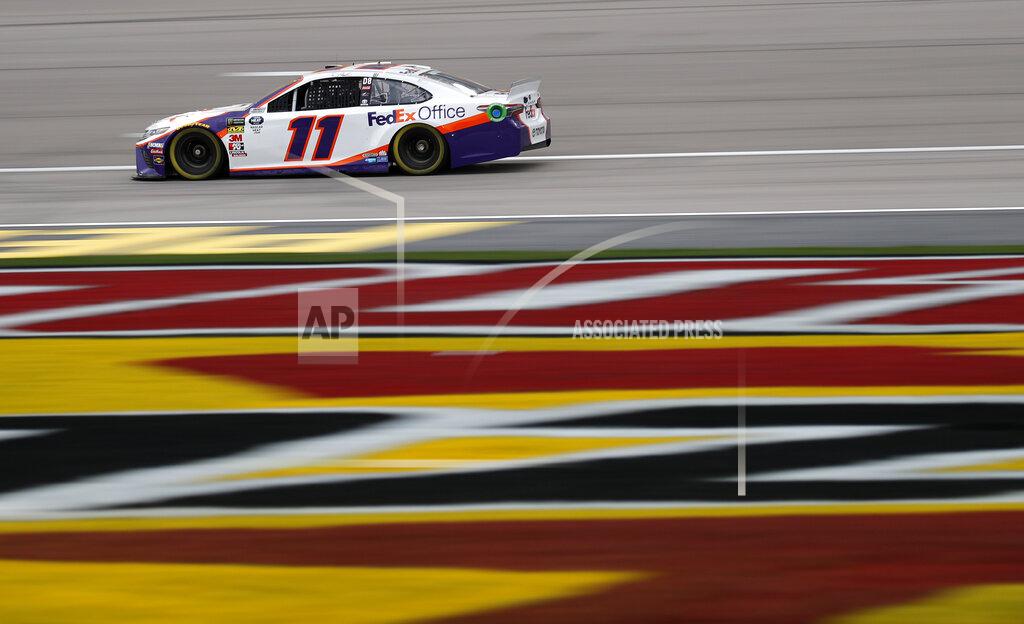 John Locher Denny Hamlin drives during qualifying for the NASCAR Cup Series auto race at Las Vegas Motor Speedway, Friday, March 1, 2019, in Las Vegas. (AP Photo/John Locher)