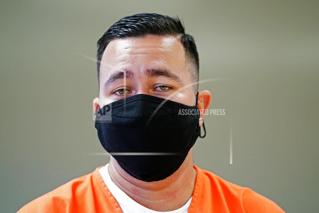 Gerald Herbert Immigration detainee Alexander Martinez speaks during an interview with The Associated Press inside the Winn Correctional Center in Winnfield, La., Friday, July 30, 2021. Since crossing the border illegally in April, the 28-year-old has bounced between six different facilities in three states. He said he contracted COVID-19, faced racist taunts and abuse from guards and was harassed by fellow detainees for being gay. (AP Photo/Gerald Herbert)