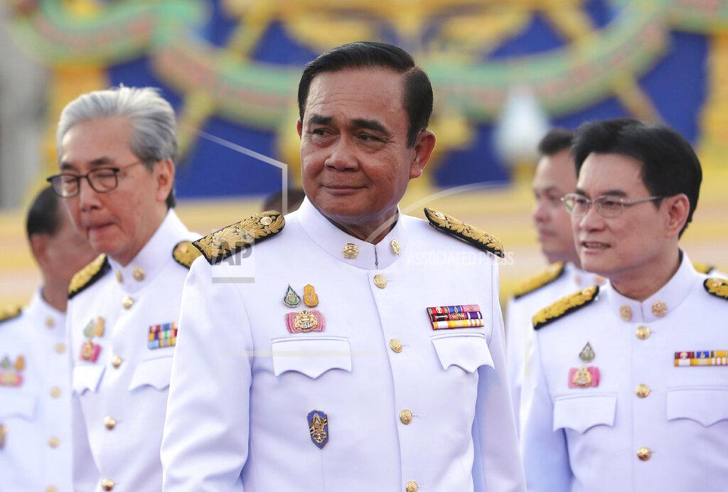 FILE - In this July 16, 2019, file photo, Thailand's Prime Minister Prayuth Chan-ocha attends a group photo with his cabinet members at the government house in Bangkok. On Thursday, Aug. 6, 2020, Prayuth reshuffled his Cabinet, with an experienced banker taking over the post of finance minister. (AP Photo/Sakchai Lalit, File)