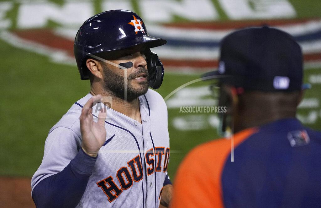 Tony Avelar Houston Astros' Jose Altuve (27) is greeted by manager Dusty Baker Jr. after scoring against the Oakland Athletics during the fourth inning of an opening-day baseball game Oakland, Calif., Thursday, April 1, 2021. (AP Photo/Tony Avelar)