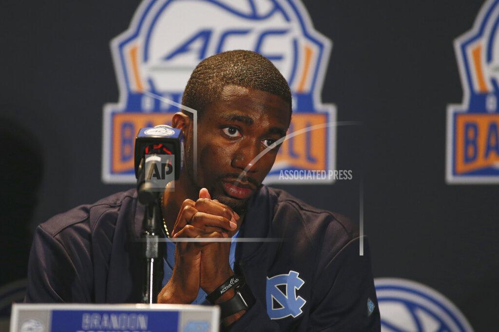 Nell Redmond North Carolina player Brandon Robinson considers a question during the Atlantic Coast Conference NCAA college basketball media day in Charlotte, N.C., Tuesday, Oct. 8, 2019. (AP Photo/Nell Redmond)