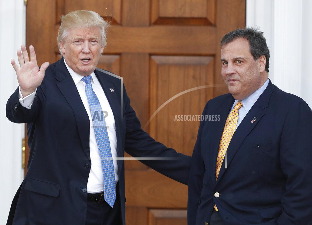 Carolyn Kaster FILE - In this Nov. 20, 2016 file photo, then President-elect Donald Trump, left, waves to the media as New Jersey Gov. Chris Christie arrives at the Trump National Golf Club Bedminster clubhouse, in Bedminster, N.J. President Trump and his allies are harking back to his own transition four years ago to make a false argument that his own presidency was denied a fair chance for a clean launch. Trump fired the head of his transition, Chris Christie, and abandoned months of planning in favor of a Cabinet hiring process. His team also ignored offers of help from the outgoing Obama administration. (AP Photo/Carolyn Kaster, File)