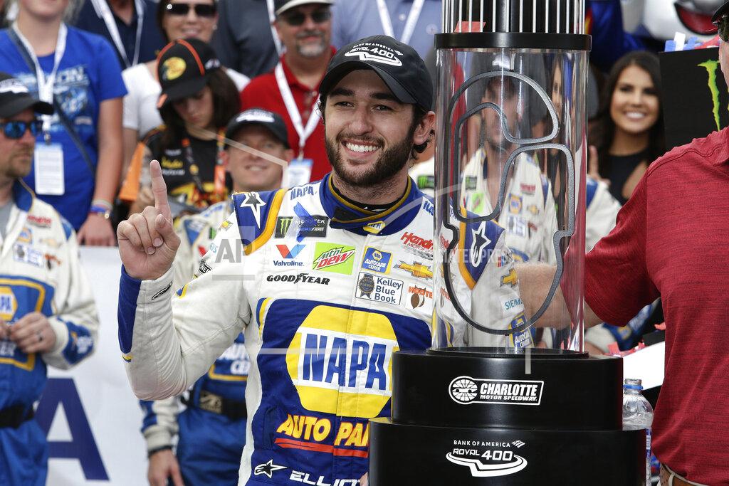 Wesley Broome Chase Elliott poses with the trophy after winning the NASCAR Cup Series auto race at Charlotte Motor Speedway in Concord, N.C., Sunday, Sept. 29, 2019. (AP Photo/Wesley Broome)
