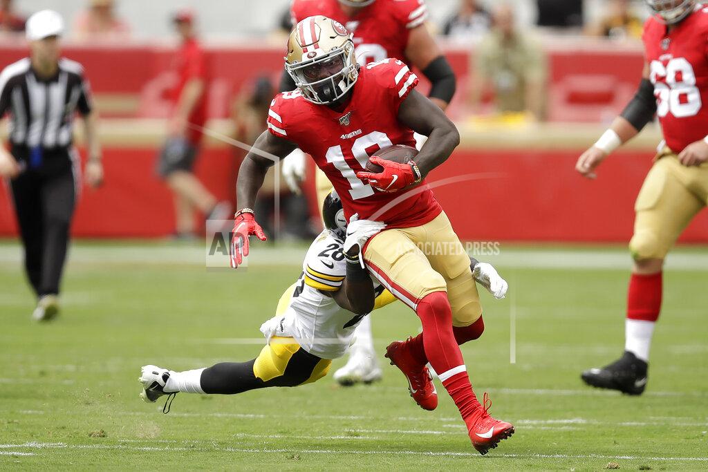 Ben Margot San Francisco 49ers wide receiver Deebo Samuel (19) runs in front of Pittsburgh Steelers cornerback Mike Hilton during the first half of an NFL football game in Santa Clara, Calif., Sunday, Sept. 22, 2019. (AP Photo/Ben Margot)