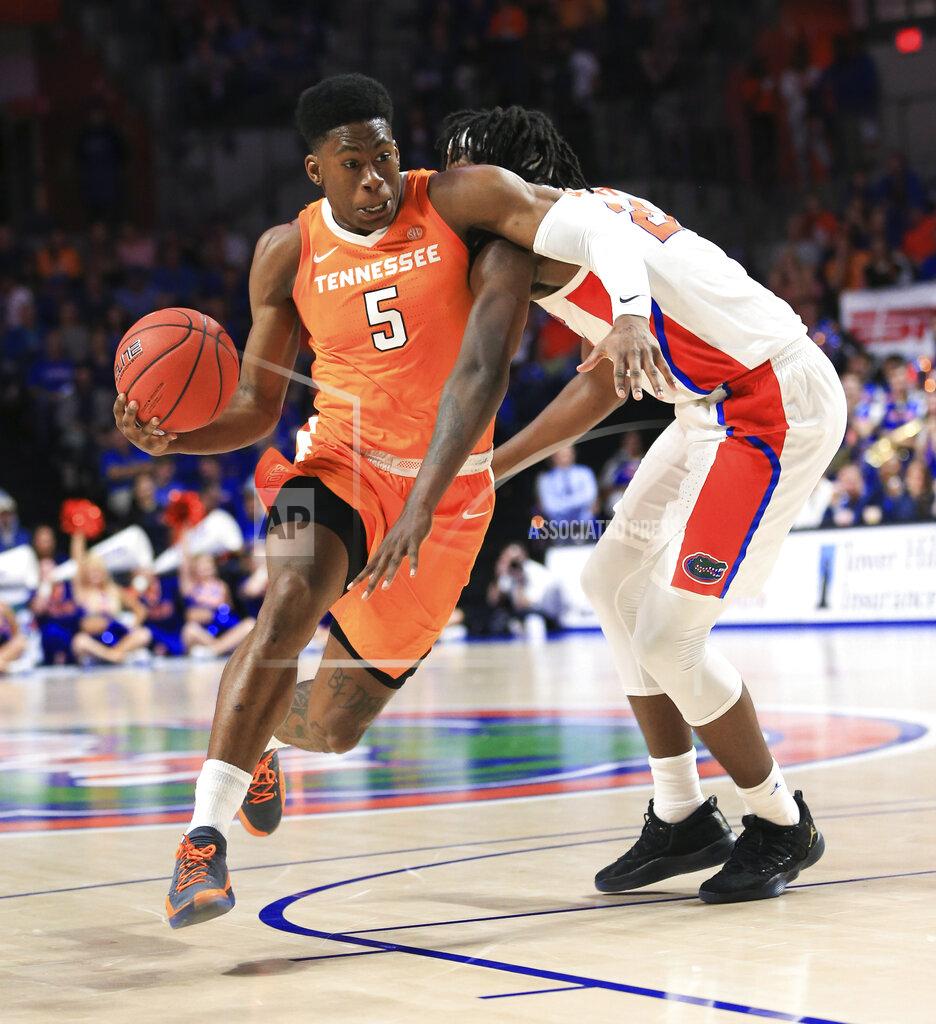 Matt Stamey Tennessee guard Admiral Schofield (5) drives past Florida forward Dontay Bassett (21) during the first half of an NCAA college basketball game Saturday, Jan. 12, 2019, in Gainesville, Fla. (AP Photo/Matt Stamey)