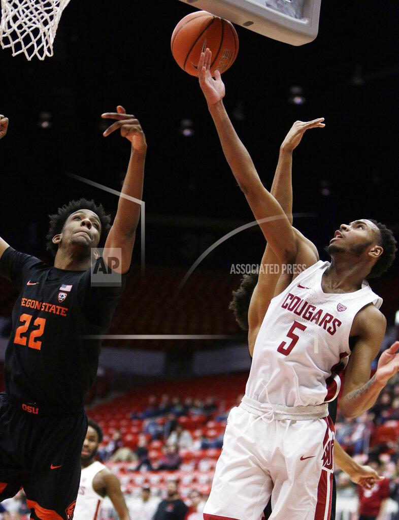 Young Kwak Oregon State forward Warren Washington (22) and Washington State forward Marvin Cannon (5) go after a rebound during the first half of an NCAA college basketball game in Pullman, Wash., Saturday, March 9, 2019. (AP Photo/Young Kwak)