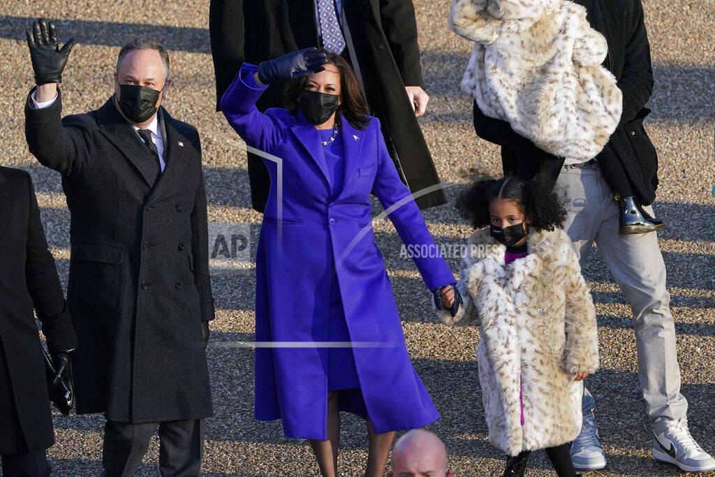 David J. Phillip Vice President Kamala Harris and her husband Doug Emhoff walk in the parade during the Presidential Escort, part of Inauguration Day ceremonies, Wednesday, Jan. 20, 2021, in Washington. (AP Photo/David J. Phillip)