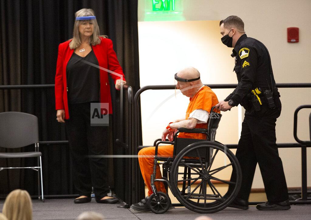 Joseph James DeAngelo, charged with being the Golden State Killer, is wheeled into the courtroom as his attorney, public defender Diane Howard, left, looks on in Sacramento, Calif., Monday June 29, 2020. DeAngelo, 74, pleaded guilty to multiple counts of murder and other charges 40 years after a sadistic series of assaults and slayings in California. Due to the large numbers of people attending, the hearing was held at a ballroom at California State University, Sacramento to allow for social distancing. (AP Photo/Rich Pedroncelli)