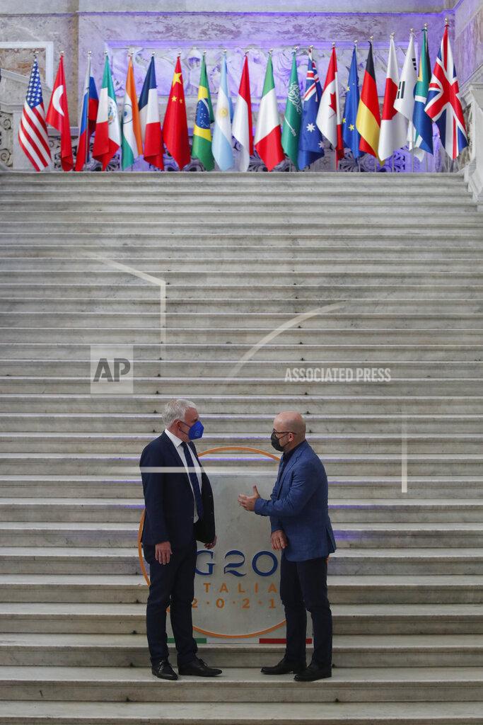 Salvatore Laporta German undersecretary of environment Jochen Flasbarth, left, is welcomed by Italian Minister for Ecological Transition Roberto Cingolani as he arrives at Palazzo Reale in Naples, Italy, Thursday, July 22, 2021, to take part in a G20 meeting on environment, climate and energy. (AP Photo/Salvatore Laporta)