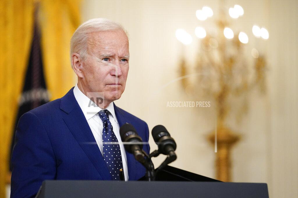 Andrew Harnik FILE - In this April 15, 2021, file photo President Joe Biden speaks about Russia in the East Room of the White House in Washington. In recent days, Biden has piled new sanctions on Russia, announced he would withdraw all U.S. troops from Afghanistan in less than five months and backed away from a campaign promise to sharply raise refugee admission caps. (AP Photo/Andrew Harnik, File)