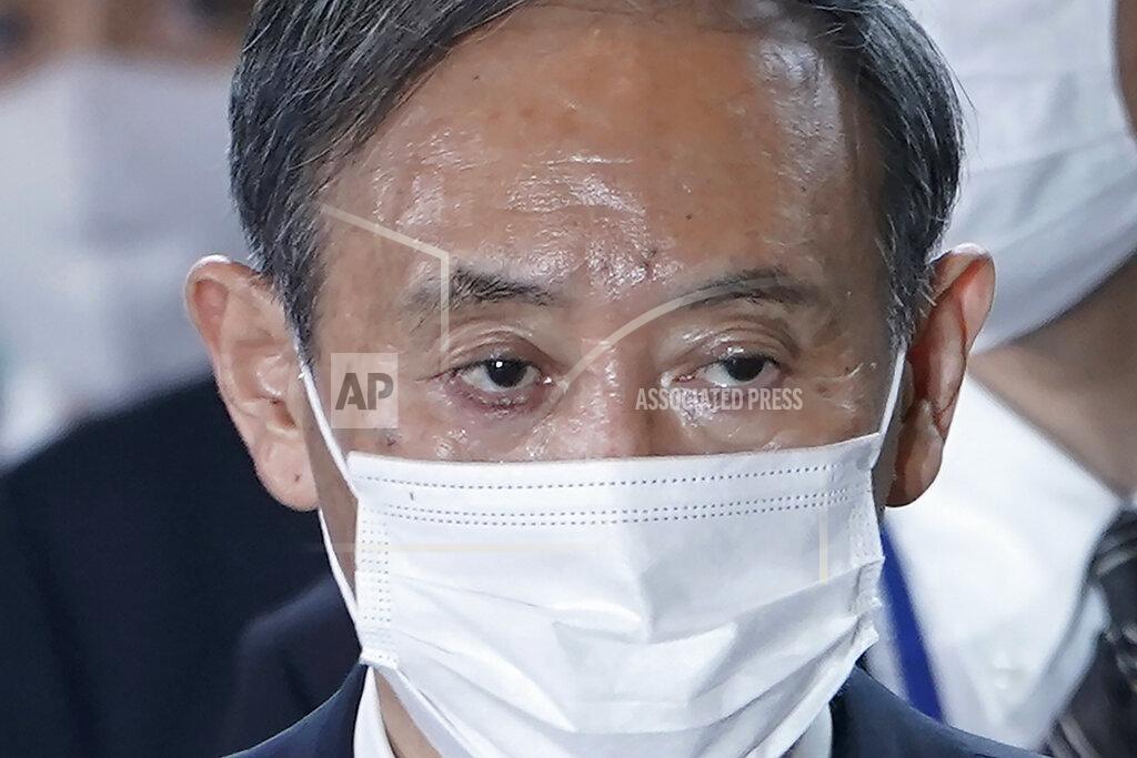 Eugene Hoshiko FILE - In this Sept. 16, 2020, file photo, Yoshihide Suga arrives at the prime minister's office after being formally elected Japan's prime minister in a parliamentary vote, succeeding Shinzo Abe, in Tokyo. Japan's new Prime Minister Suga heads to Vietnam and Indonesia on Sunday, Oct. 18, 2020, on his first overseas foray since taking over from his former boss Shinzo Abe last month. (AP Photo/Eugene Hoshiko, File)