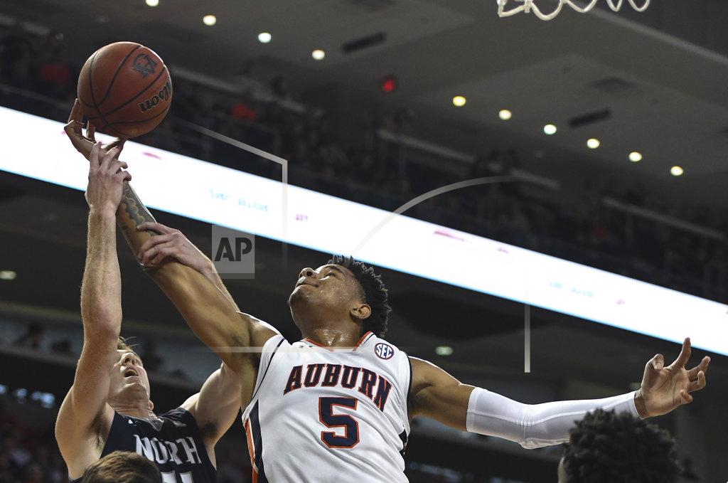 Julie Bennett North Florida's Garrett Sams (11) stops a rebound by Auburn forward Chuma Okeke (5) during the first half of an NCAA college basketball game Saturday, Dec. 29, 2018, in Auburn, Ala. (AP Photo/Julie Bennett)
