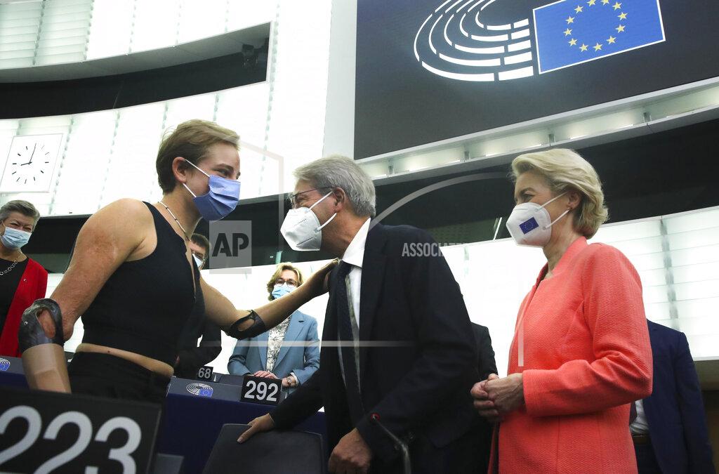 Yves Herman European Commissioner for Economy Paolo Gentiloni, center, and European Commission President Ursula von der Leyen, right, speak with speak with Tokyo 2020 Paralympic gold medallist Beatrice Vio at the European Parliament in Strasbourg, France, Wednesday, Sept. 15, 2021. The European Union announced Wednesday it is committing 200 million more coronavirus vaccine doses to Africa to help curb the COVID-19 pandemic on a global scale. (Yves Herman, Pool via AP)