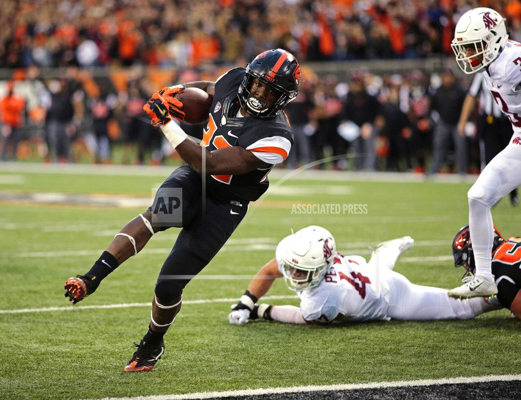 Timothy J. Gonzalez Oregon State running back Jemar Jefferson, center, breaks through the Washington State defense for a touchdown during the first half of an NCAA college football in Corvallis, Ore., Saturday, Oct. 6, 2018. (AP Photo/Timothy J. Gonzalez)