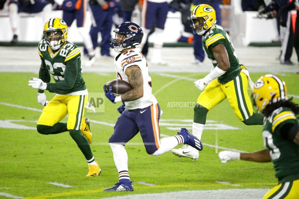 Mike Roemer Chicago Bears' David Montgomery runs during the first half of an NFL football game against the Green Bay Packers Sunday, Nov. 29, 2020, in Green Bay, Wis. (AP Photo/Mike Roemer)